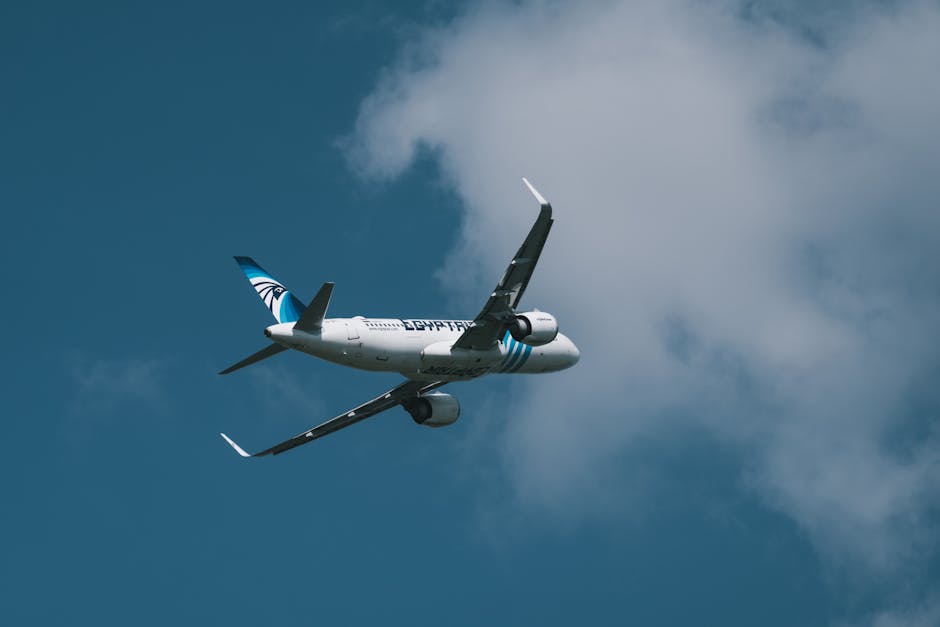 A passenger jet taking off into a clear blue sky, symbolizing travel and aviation.